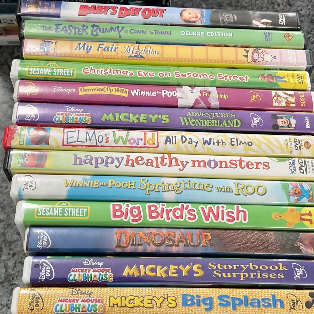12 kids DVD videos. Elmo, Pooh, Mickey Mouse and more.